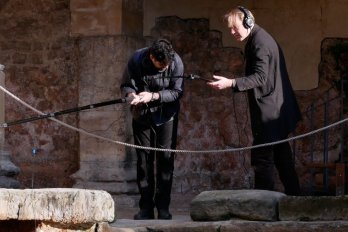 Two men use recording equipment at the Roman Baths 