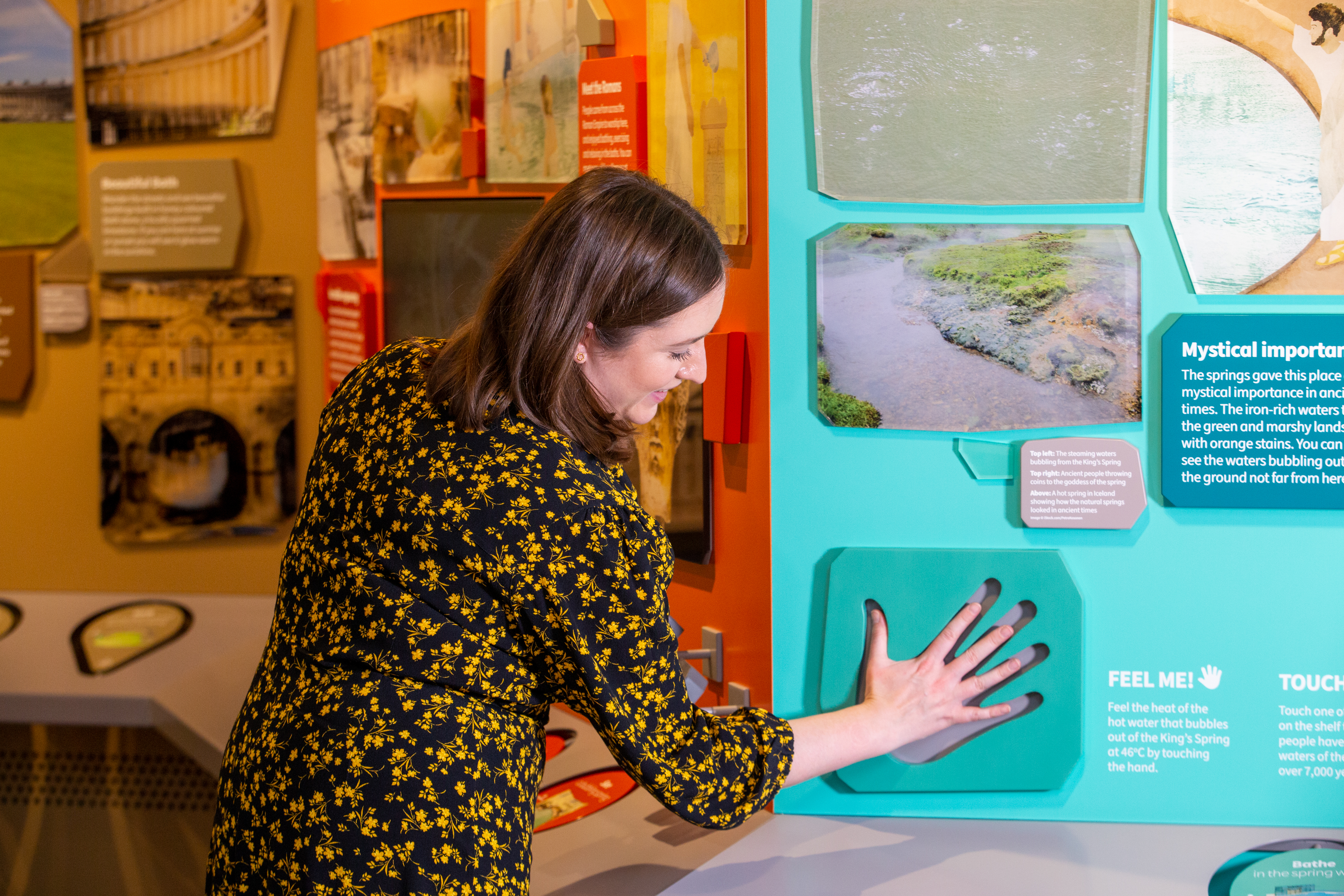 Image: A visitor trying out an interactive display