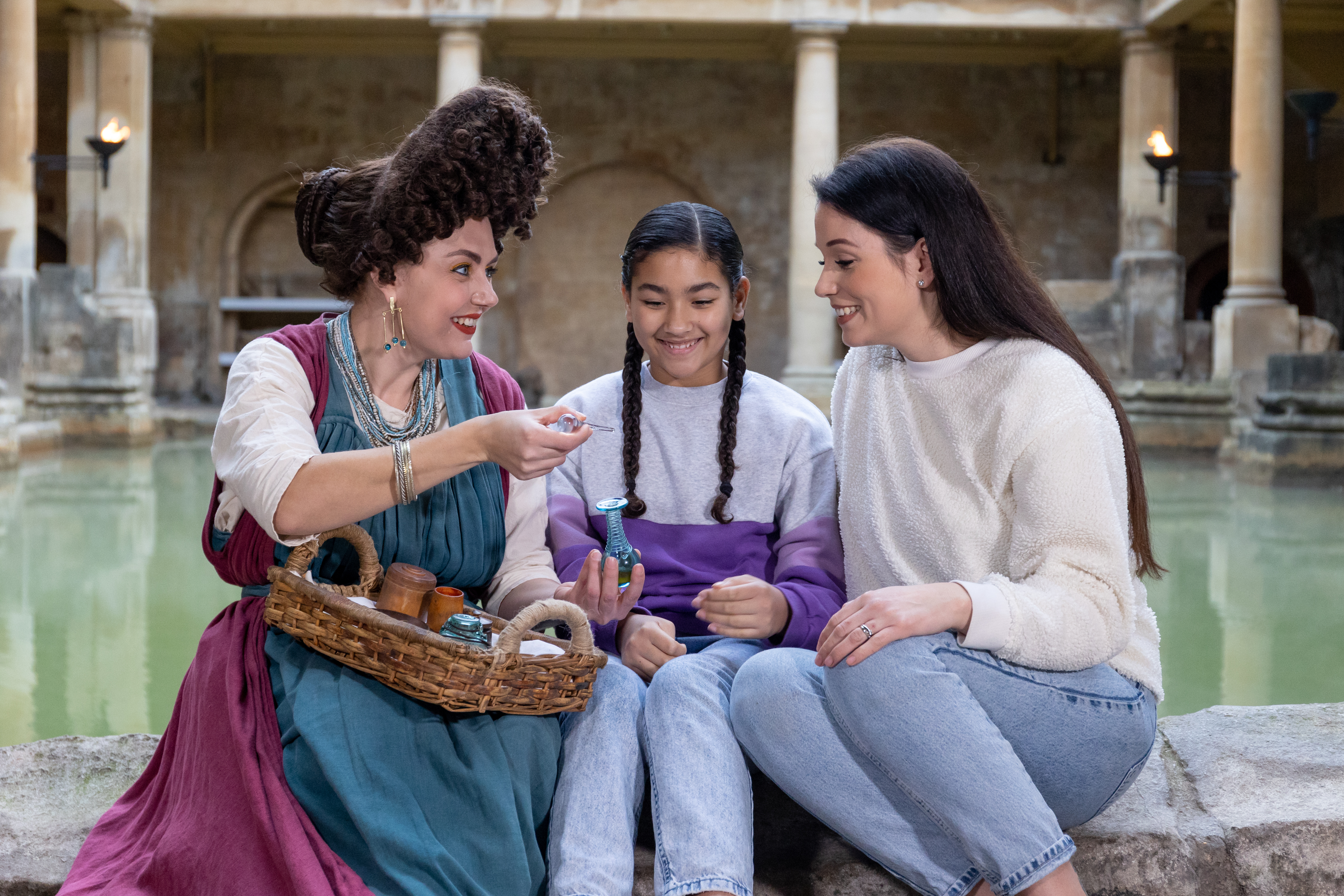 Image: Visitors interacting with a costumed character