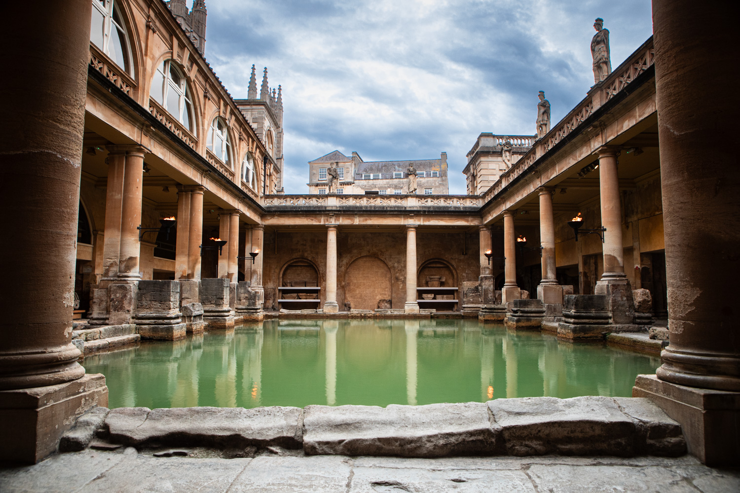 Image: The Great Bath filled with spa water. The water is a green colour.