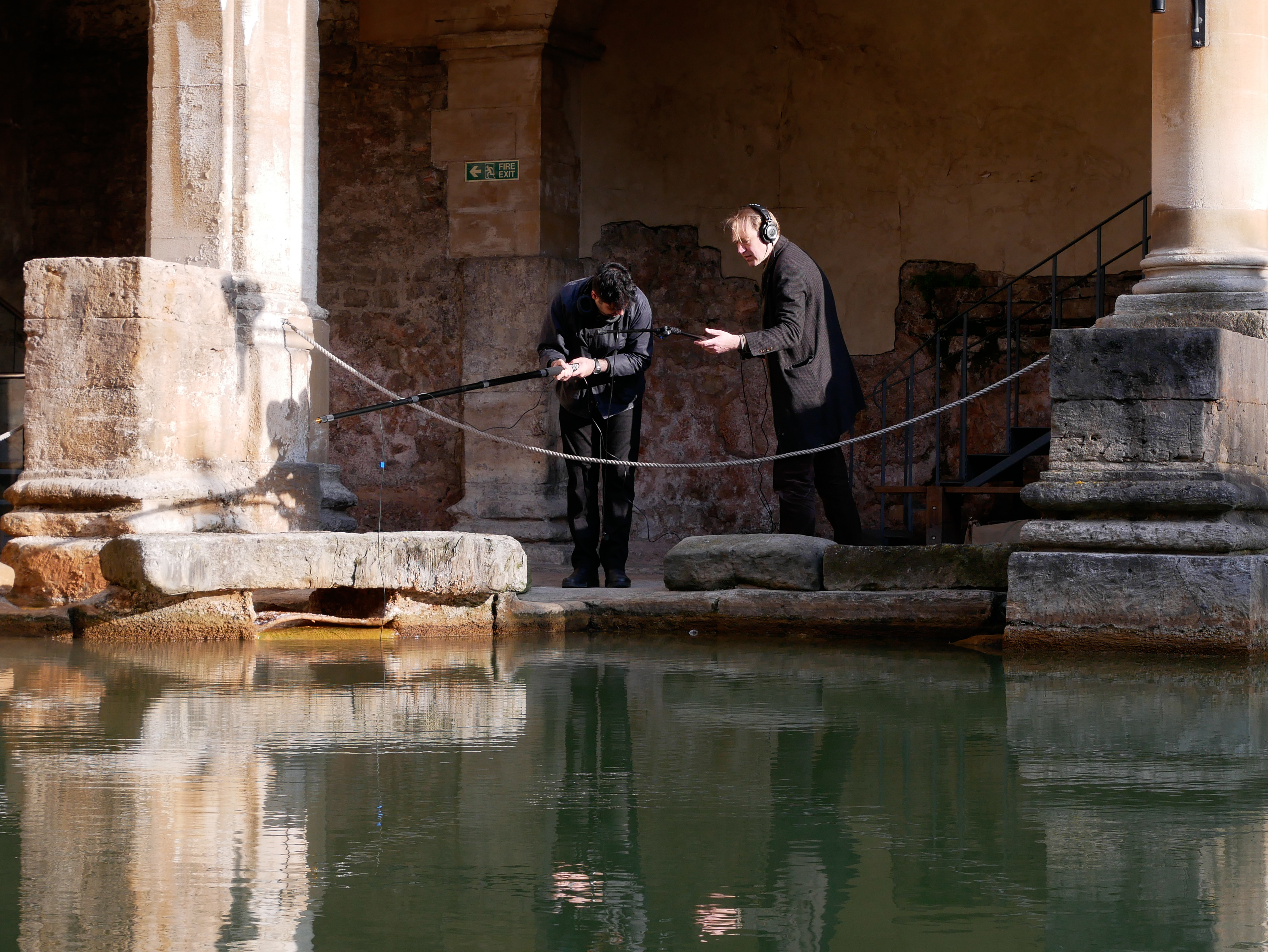 Image: People recording sound beside the Great Bath