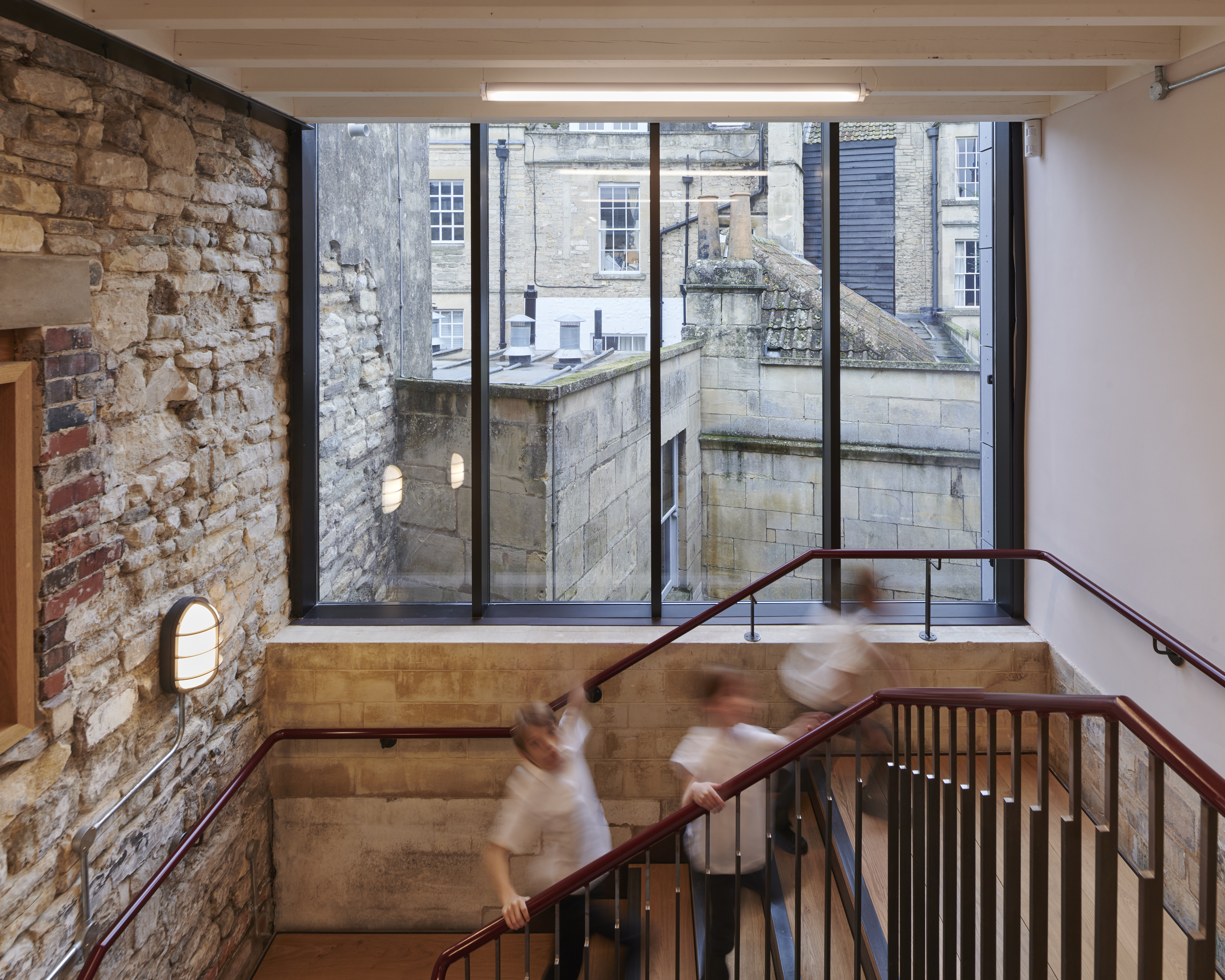 Children walking up stairs in the Roman Baths Clore Learning Centre