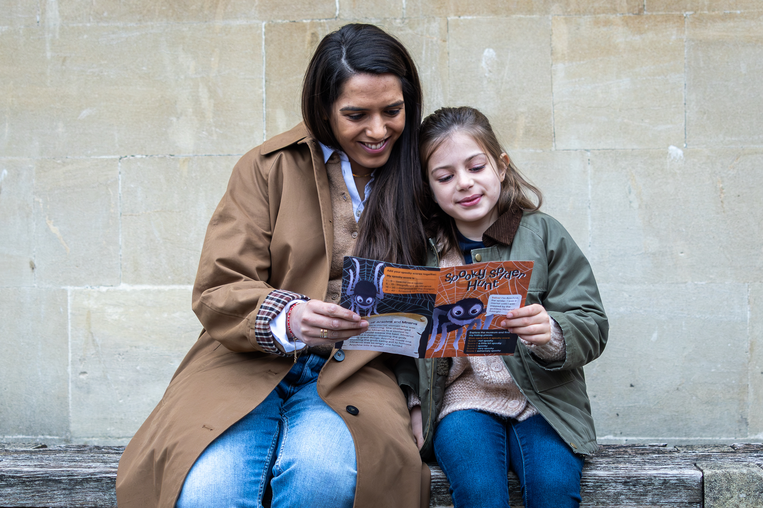 mother and daughter looking at leaflet