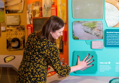 Image: A visitor trying out an interactive display