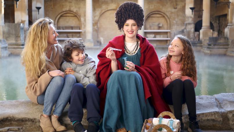 Image: A family interacting with a costumed character