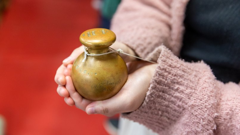 Visitor touching a pot
