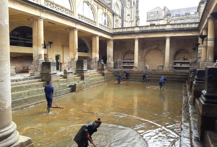 Image: Operations staff cleaning the Great Bath